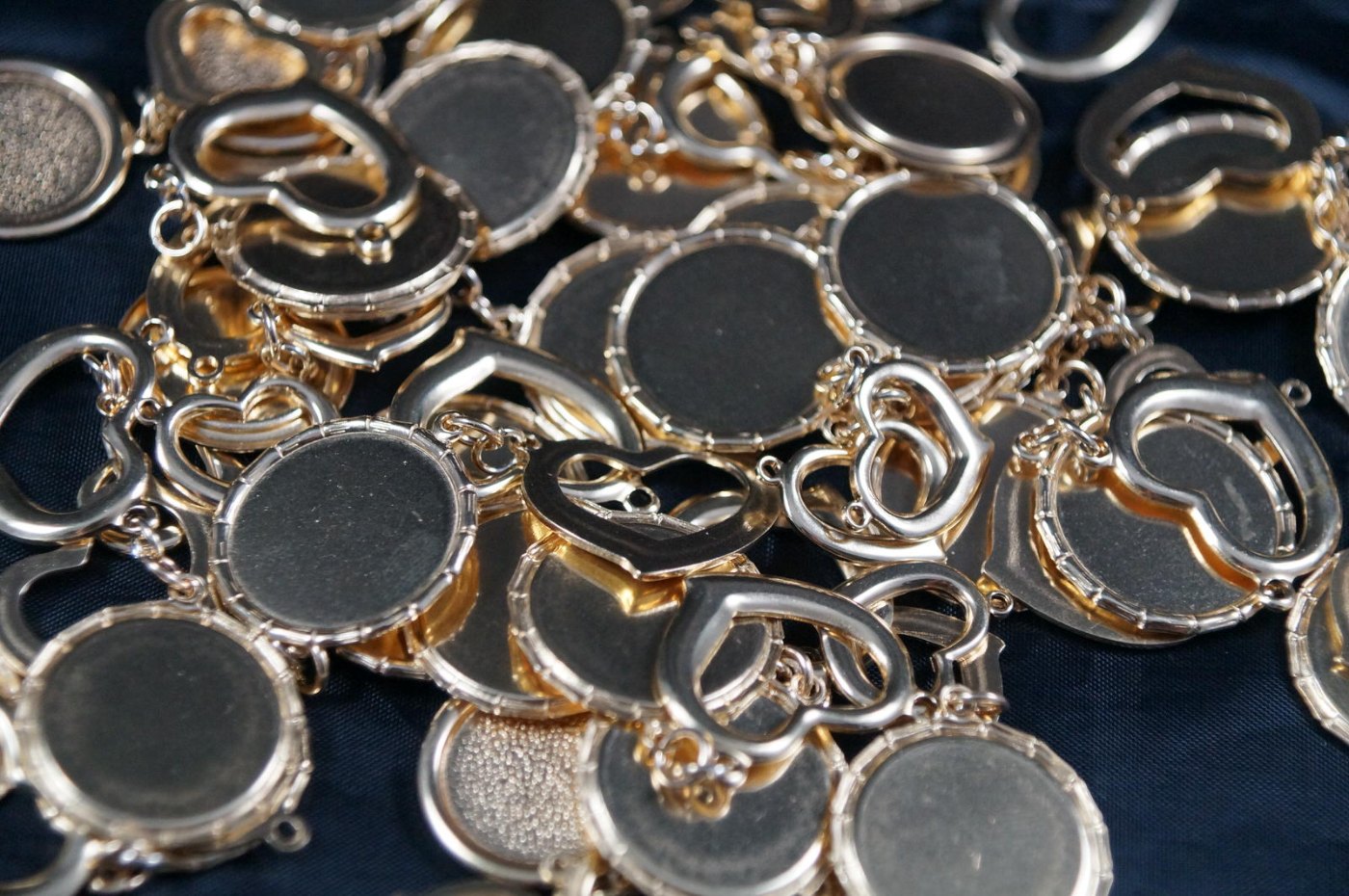 A batch of silver-plated pendant settings