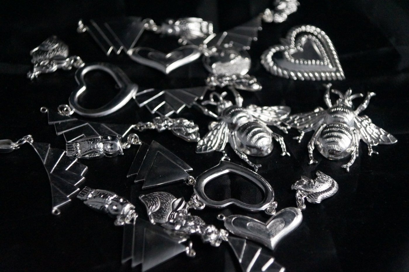 Assorted silver-plated charms, hearts and bees