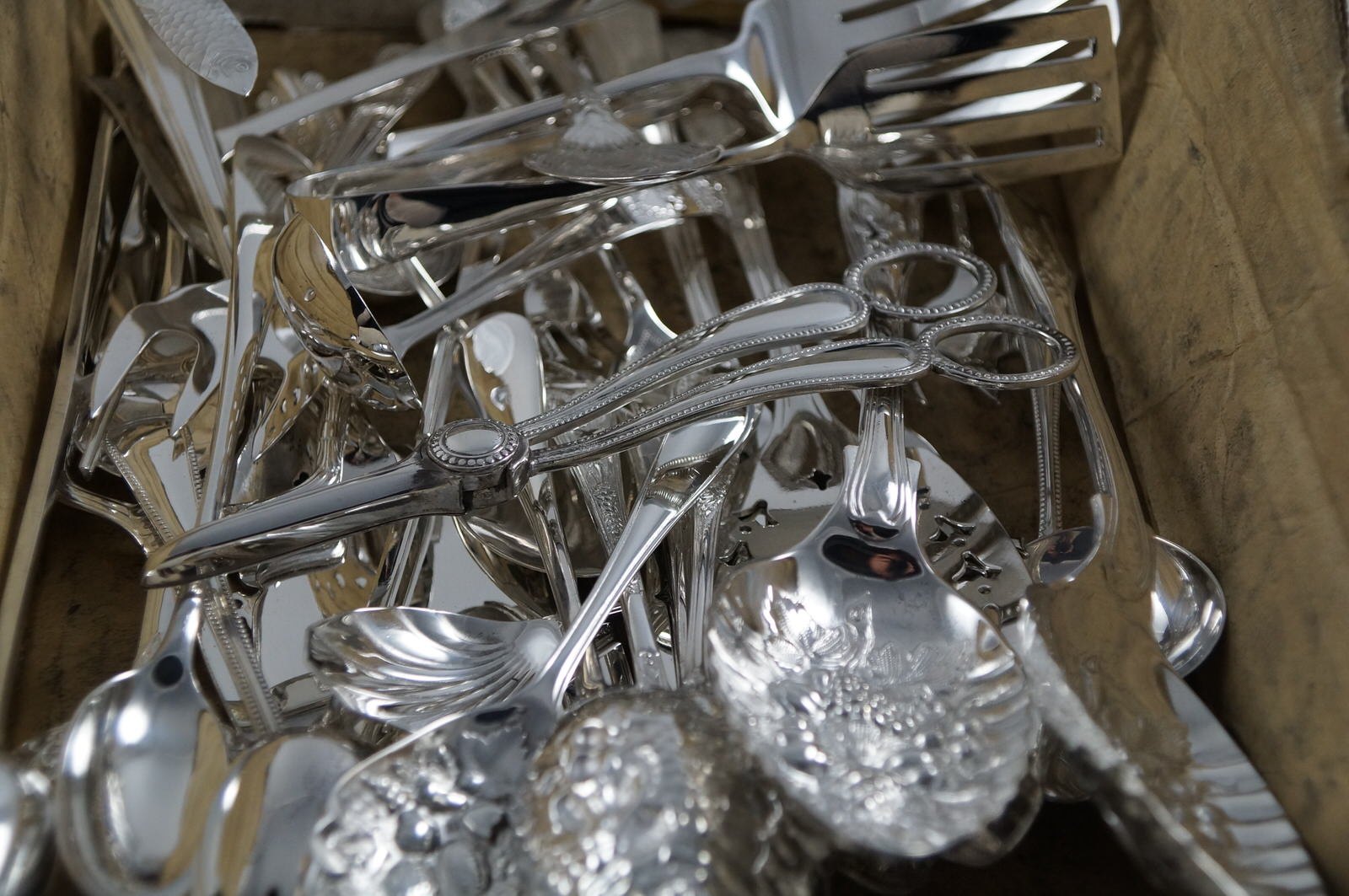 A box of freshly re-plated and polished silverware
