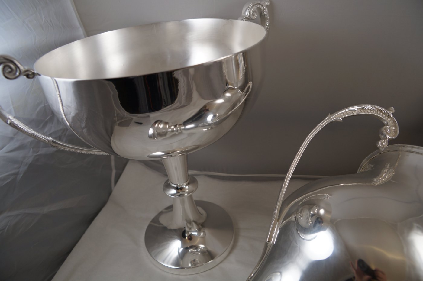 Large silver presentation cup with scrolled handles after re-plating