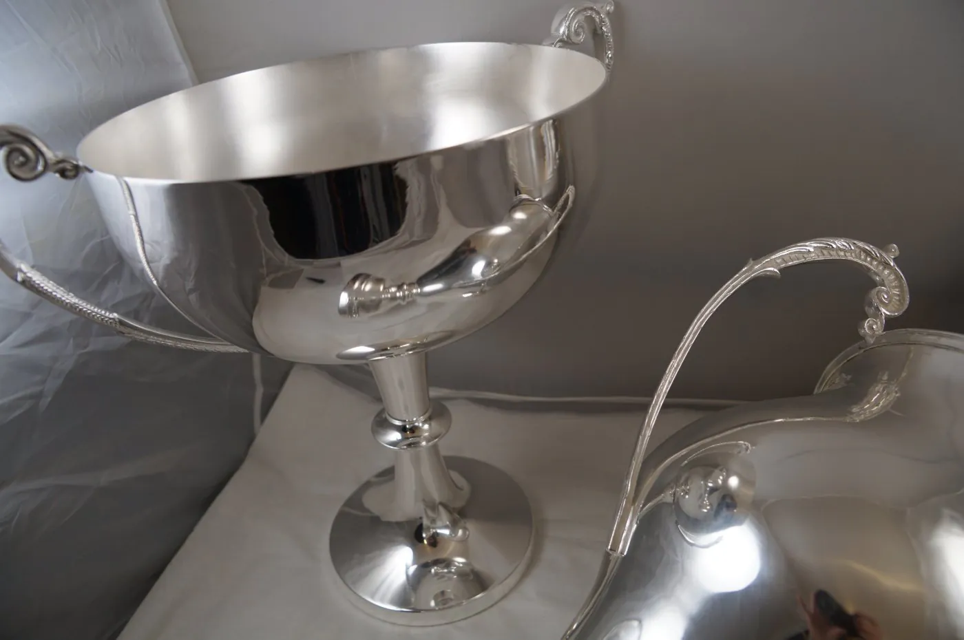 Large silver presentation cup with scrolled handles after re-plating